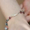 ÉLETERŐ Karkötő - Anyai Kötelék - MOM, szív charm és 925 Sterling Ezüst gömbök, - Fazettált Turmalin ásvány gyöngyök - Zöld zsinór