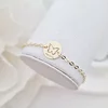 Bratara personalizata cu nume - Fluture decupat - Aur Galben 9K - Banut 12 mm diametru - Cu lantisor fata/baiat