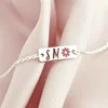 Bratara placuta simbol floare - initiale personalizate - Argint 925- Cu lantisor fata/baiat