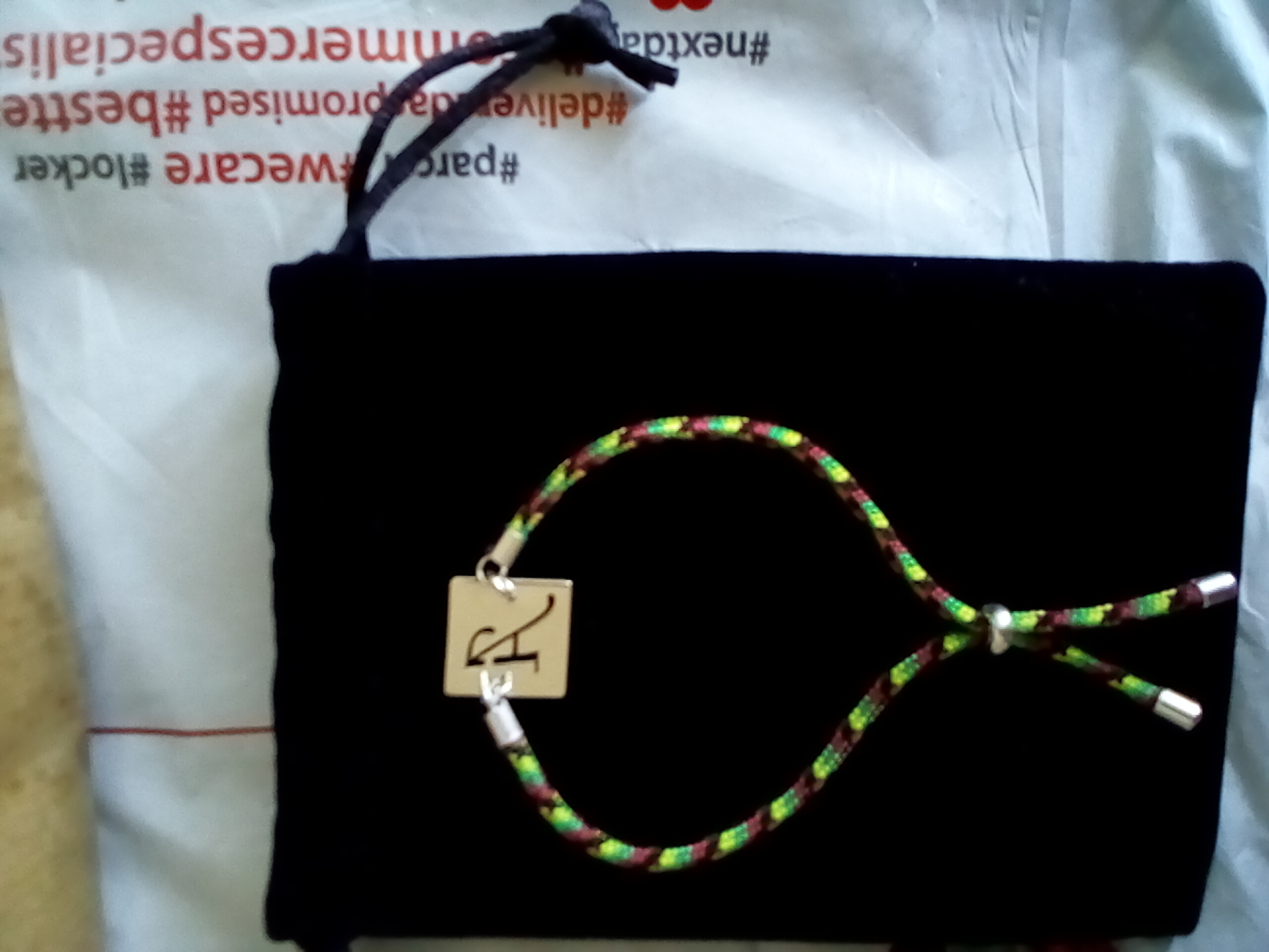 Recenzie Bratara personalizata - Banut 15 mm cu inima decupata -  Argint 925 - Snur 2 mm paracord, colorat si reglabil - Elena C.