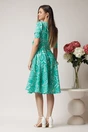 Rochie de zi din voal verde cu imprimeuri si floare in talie
