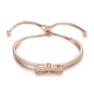 Ezüst rózsa kivert masnis karkötő