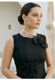 Rochie de gala asimetrica decorata cu flori si perle ton in ton